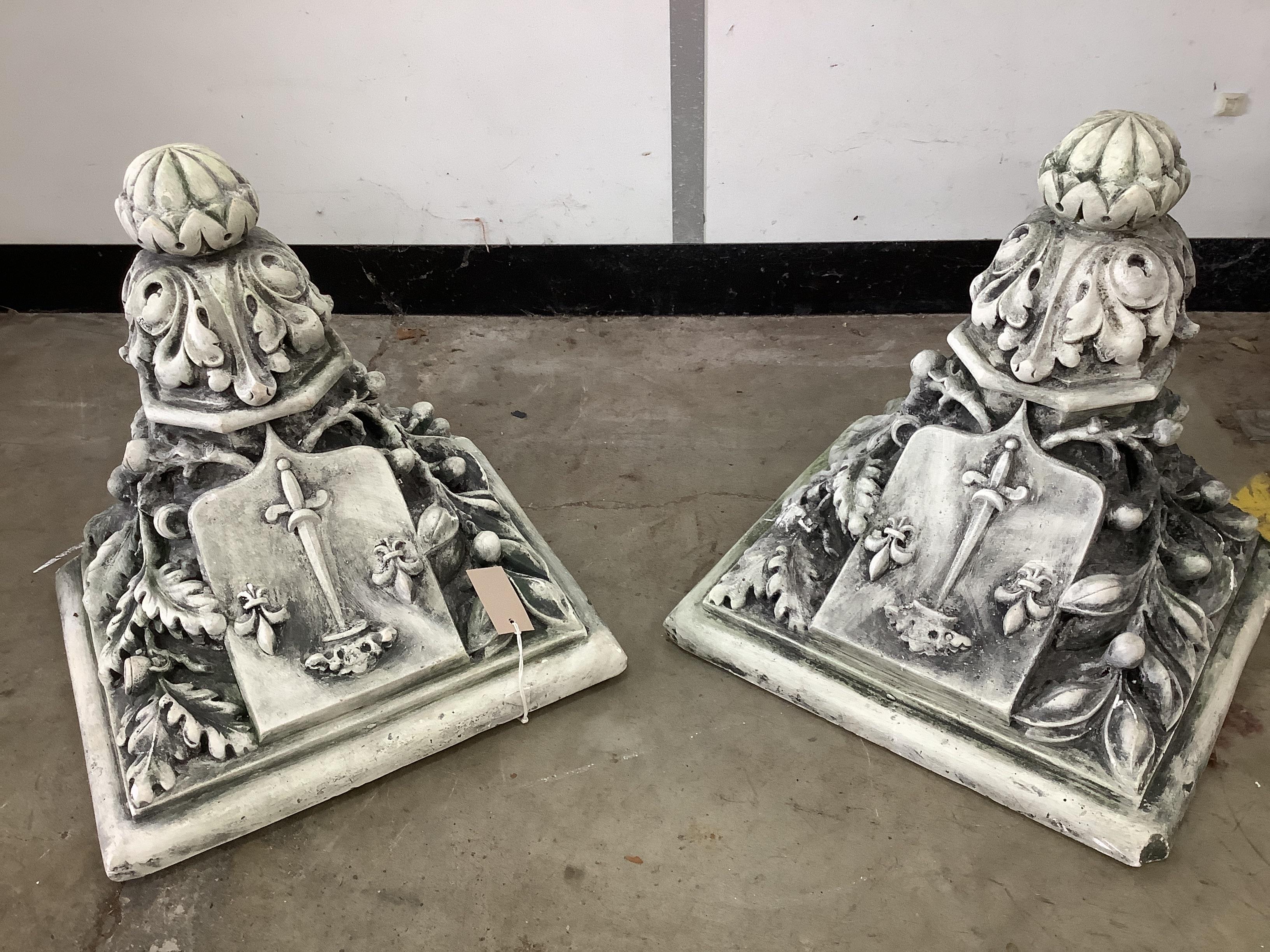 A pair of cast plaster garden wall brackets, bearing the logo of Joan of Arc, width 42cm, depth 38cm, height 39cm